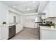 Modern kitchen featuring stainless appliances, quartz countertops, and ample cabinet space at 15 Bunker Pl, Rotonda West, FL 33947