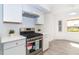 Updated kitchen showcasing stainless steel appliances and crisp white cabinetry at 15 Bunker Pl, Rotonda West, FL 33947