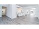 Open concept living area showcasing wood-look floors and neutral walls at 15 Bunker Pl, Rotonda West, FL 33947