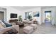 Bright living room with modern furniture, decor, and view to outdoor space at 15 Bunker Pl, Rotonda West, FL 33947