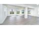 Spacious living room with new vinyl flooring, natural lighting, and a neutral paint at 15 Bunker Pl, Rotonda West, FL 33947