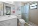 Bathroom with a glass shower, and bright vanity with ample counter space at 15 Oakland Hills Pl, Rotonda West, FL 33947