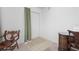 Clean hallway featuring neutral tile flooring and simple decor at 15 Oakland Hills Pl, Rotonda West, FL 33947