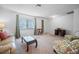Bright living room with comfortable seating, classic furniture, and natural light at 15 Oakland Hills Pl, Rotonda West, FL 33947