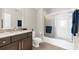 Neutral bathroom featuring dark vanity, shower, modern lighting, and neutral colors at 15521 Lakeland Cir, Port Charlotte, FL 33981