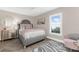 Bright bedroom with stylish furniture, artwork, and lots of natural light at 15521 Lakeland Cir, Port Charlotte, FL 33981