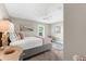 Cozy bedroom featuring plush accents, neutral colors, and a large window at 15521 Lakeland Cir, Port Charlotte, FL 33981