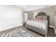Bedroom featuring zebra rug, closet, and stylish neutral decor and artwork at 15521 Lakeland Cir, Port Charlotte, FL 33981