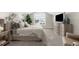 Primary bedroom featuring lots of natural light, vaulted ceilings, and modern TV at 15521 Lakeland Cir, Port Charlotte, FL 33981