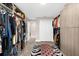 Walk-in closet featuring zebra rug, custom shelving, and lots of storage at 15521 Lakeland Cir, Port Charlotte, FL 33981