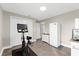 Bright exercise room with stationary bike, tile floors and a refrigerator at 15521 Lakeland Cir, Port Charlotte, FL 33981