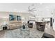 Spacious open concept living room with great seating, kitchen access, and plenty of room for entertaining at 15521 Lakeland Cir, Port Charlotte, FL 33981