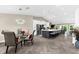 Open concept living featuring dining room, kitchen island with seating and living space at 15521 Lakeland Cir, Port Charlotte, FL 33981