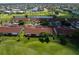 An aerial view showing a meticulously maintained community with a golf course at 1640 Atares # 23, Punta Gorda, FL 33950