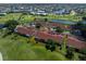 Aerial view of white and red roof condos in a beautiful golf community on a sunny day at 1640 Atares # 23, Punta Gorda, FL 33950