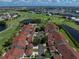 An aerial view captures townhomes within a golf course community near lakes at 1640 Atares # 23, Punta Gorda, FL 33950