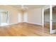 A spacious bedroom with wood floors, ceiling fan, and multiple doorways at 1640 Atares # 23, Punta Gorda, FL 33950