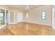 Spacious bedroom with wood floors, white trim, and abundant natural light at 1640 Atares # 23, Punta Gorda, FL 33950