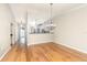 Dining room with hardwood floors, chandelier, and view of the kitchen at 1640 Atares # 23, Punta Gorda, FL 33950