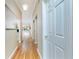 Hallway with hardwood floors leads to open living spaces at 1640 Atares # 23, Punta Gorda, FL 33950