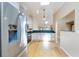Bright kitchen with hardwood floors, stainless steel appliances, and light-colored cabinetry at 1640 Atares # 23, Punta Gorda, FL 33950