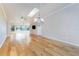 Bright living room featuring hardwood floors, a skylight, and a chandelier at 1640 Atares # 23, Punta Gorda, FL 33950