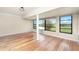 Spacious living room featuring hardwood floors, natural light, and large windows at 1640 Atares # 23, Punta Gorda, FL 33950