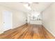 Bright living room with hardwood floors, skylight, and a doorway at 1640 Atares # 23, Punta Gorda, FL 33950