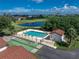 Beautiful community pool and shuffleboard courts feature a nearby pond and golf course at 1640 Atares # 23, Punta Gorda, FL 33950