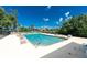Inviting swimming pool with lounge chairs and a serene view of the surrounding landscape at 1640 Atares # 23, Punta Gorda, FL 33950