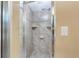 Modern tiled shower featuring built-in shelves and a sleek, adjustable shower head at 1640 Atares # 23, Punta Gorda, FL 33950