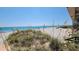 Beautiful view of a white sand beach and blue ocean seen from the condo at 1760 Gulf Blvd # 511, Englewood, FL 34223