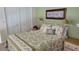 Cozy bedroom featuring a double closet for ample storage at 1760 Gulf Blvd # 511, Englewood, FL 34223