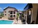 Exterior of a community complex, showcasing community pool, landscaping and outdoor access at 1760 Gulf Blvd # 511, Englewood, FL 34223