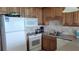 Well-appointed kitchen with modern appliances, granite countertops, and a tile backsplash at 1760 Gulf Blvd # 511, Englewood, FL 34223