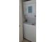 Efficient laundry setup with stacked washer and dryer at 1760 Gulf Blvd # 511, Englewood, FL 34223