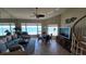 Beautiful condo living room with ocean view and elegant spiral staircase at 1760 Gulf Blvd # 511, Englewood, FL 34223