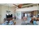 Open floor plan showcasing kitchen, dining area, and spiral staircase leading to a loft, maximizing space and style at 1760 Gulf Blvd # 511, Englewood, FL 34223