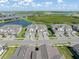 Aerial view of the Wellen Park townhomes community near a scenic lake at 17605 Boracay Ct # 201, Venice, FL 34293
