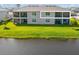 Backyard featuring a serene lake view at 17605 Boracay Ct # 201, Venice, FL 34293