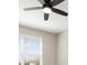 Bright bedroom featuring a ceiling fan and a window that offers ample natural light at 17605 Boracay Ct # 201, Venice, FL 34293