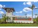 Wellen Park Golf & Country Club's sign with lush landscaping and clear blue sky at 17605 Boracay Ct # 201, Venice, FL 34293