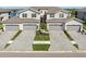 Wellen Park townhomes feature attached garages and landscaped front yards at 17605 Boracay Ct # 201, Venice, FL 34293