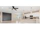 Elegant open-concept kitchen and living space with modern fixtures, a large island, and stainless steel appliances at 17605 Boracay Ct # 201, Venice, FL 34293