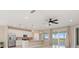 Modern kitchen features stainless steel appliances, a kitchen island with pendant lighting, and an airy, open layout at 17605 Boracay Ct # 201, Venice, FL 34293