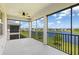Screened patio with a tranquil lake view at 17605 Boracay Ct # 201, Venice, FL 34293
