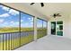 Relaxing screened patio offering expansive water views at 17605 Boracay Ct # 201, Venice, FL 34293