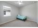 Neutral bedroom with carpet, ceiling fan, window with blinds, and small bed at 17921 Grand Prosperity Dr, Venice, FL 34293