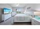 Inviting bedroom features an entertainment center and coastal-inspired decor at 17921 Grand Prosperity Dr, Venice, FL 34293