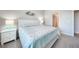 Well-lit bedroom features coastal-inspired decor and carpet flooring at 17921 Grand Prosperity Dr, Venice, FL 34293